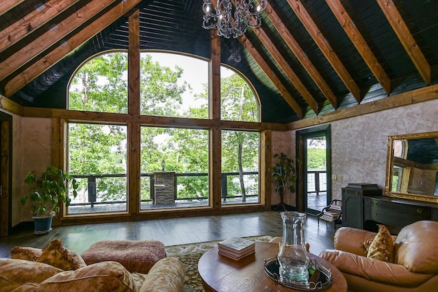 living room with a notable chandelier, hardwood / wood-style flooring, high vaulted ceiling, beam ceiling, and plenty of natural light