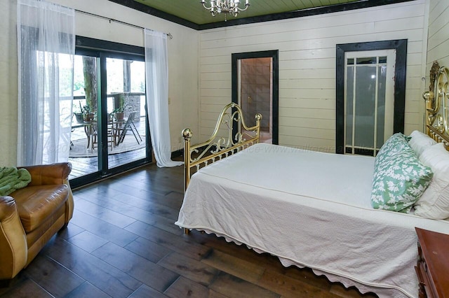 bedroom with wood ceiling, a chandelier, access to exterior, wood walls, and dark hardwood / wood-style floors