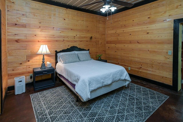 bedroom featuring ceiling fan and wood walls