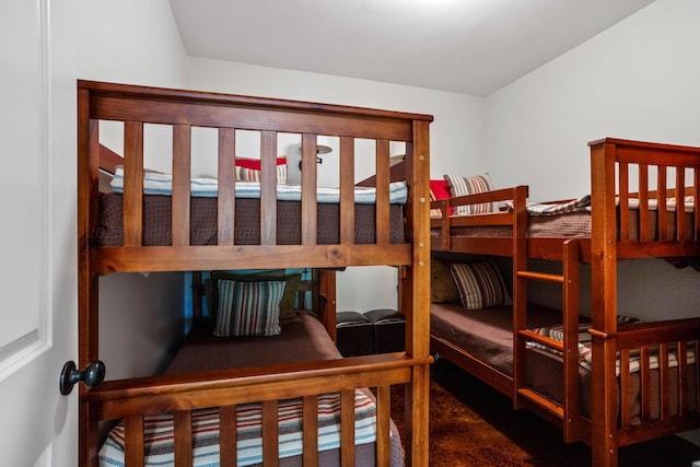 bedroom featuring dark carpet