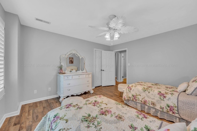 bedroom featuring ceiling fan and hardwood / wood-style flooring