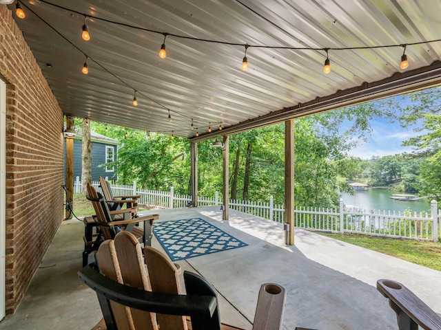 view of patio with a water view