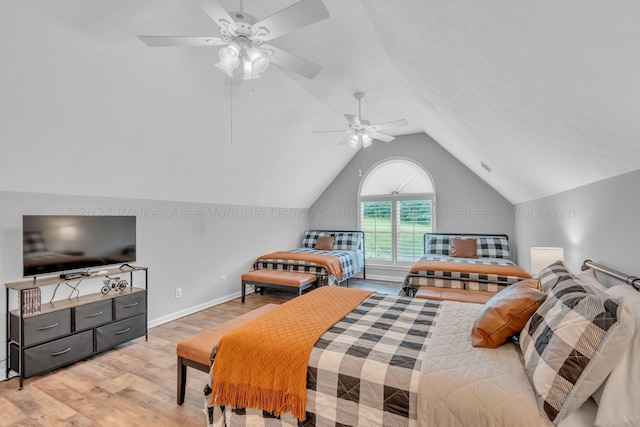 bedroom featuring light wood-type flooring, ceiling fan, and lofted ceiling