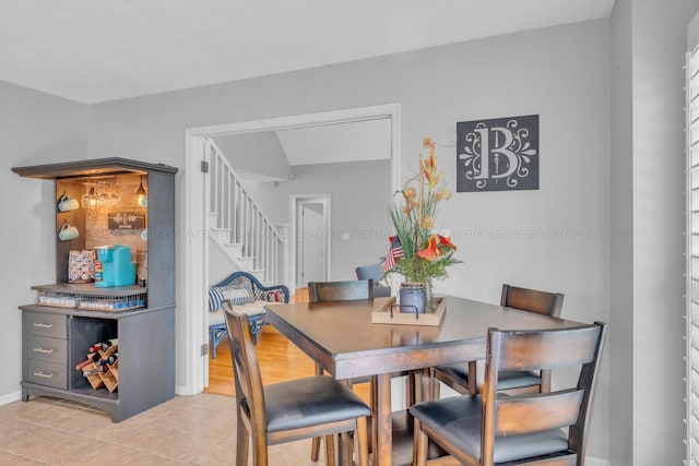 dining area with light tile patterned floors