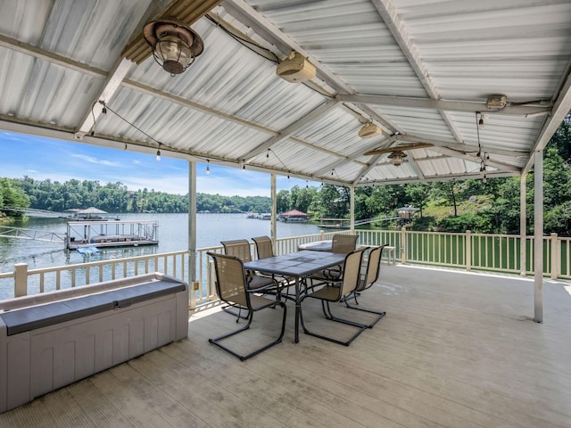 view of patio featuring a deck with water view