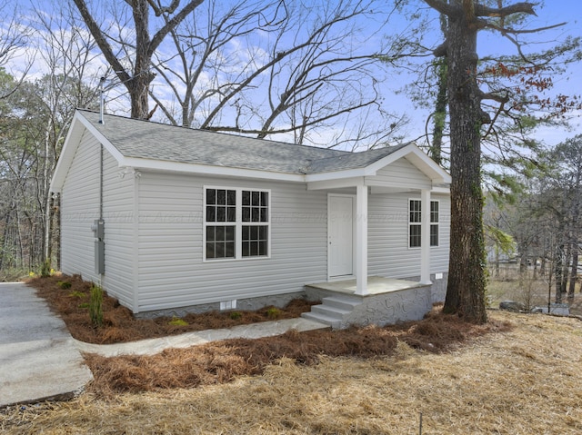 view of front of house featuring a shingled roof