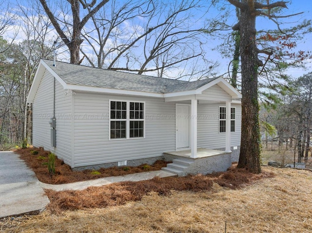 view of front of house with roof with shingles