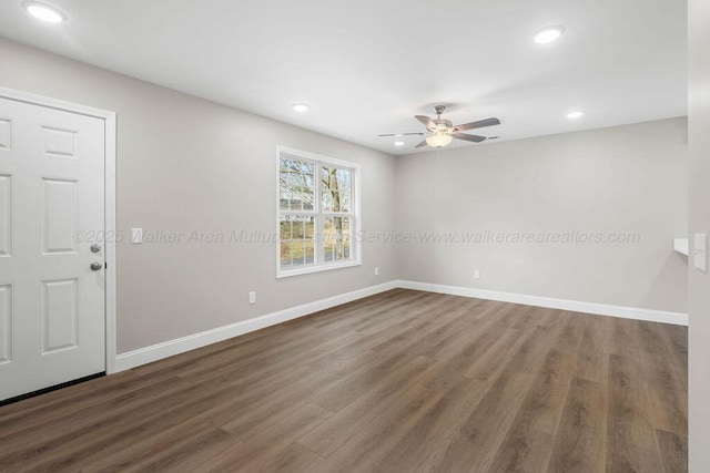 unfurnished room with dark wood-style flooring, baseboards, recessed lighting, and a ceiling fan