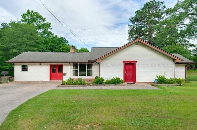 ranch-style home with a front lawn