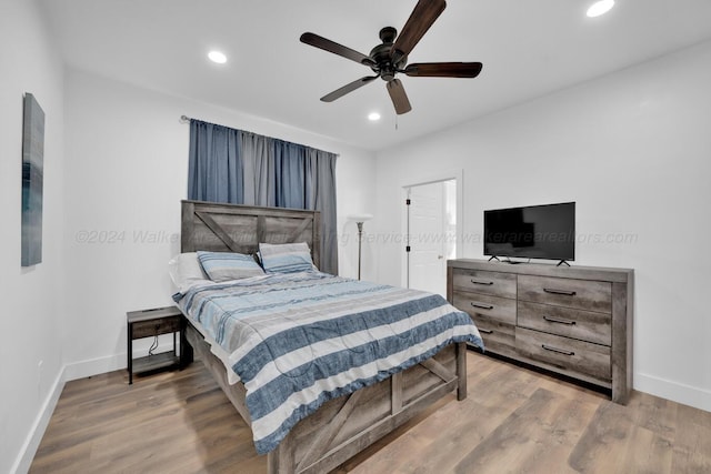 bedroom featuring ceiling fan and hardwood / wood-style flooring