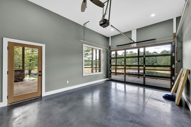 garage featuring ceiling fan and a garage door opener