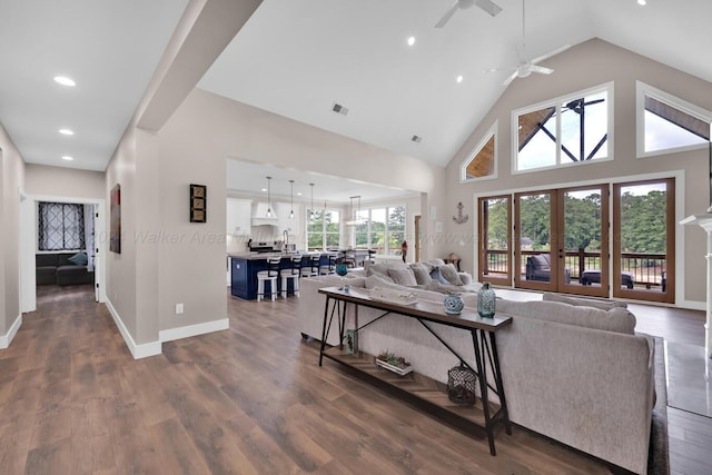 living room featuring high vaulted ceiling, french doors, sink, ceiling fan, and dark hardwood / wood-style flooring