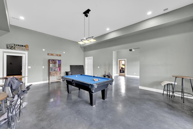 game room featuring a towering ceiling and pool table