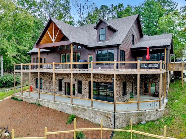 back of house with a patio and a wooden deck