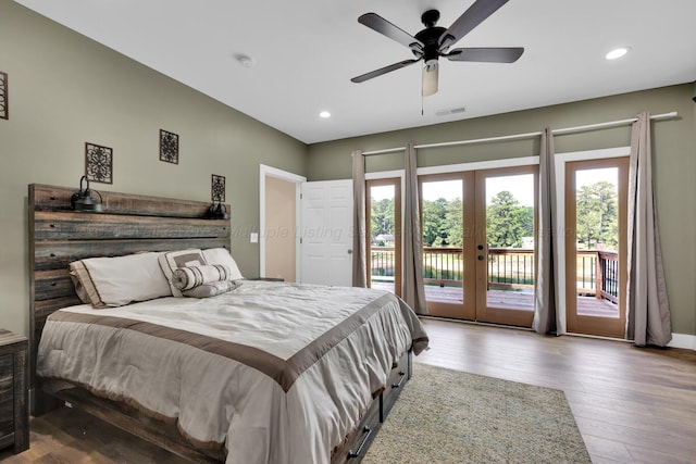 bedroom with access to exterior, french doors, light wood-type flooring, and ceiling fan