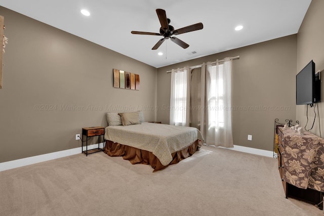 carpeted bedroom with ceiling fan