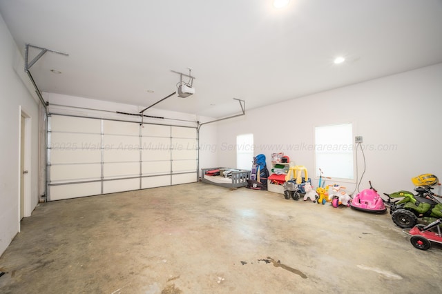 garage featuring a garage door opener