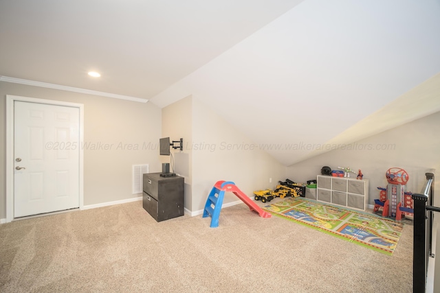 recreation room with visible vents, baseboards, vaulted ceiling, crown molding, and carpet flooring