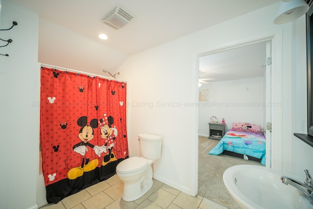 bathroom with tile patterned floors, visible vents, toilet, a sink, and ensuite bath