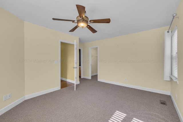 unfurnished bedroom featuring carpet flooring and ceiling fan