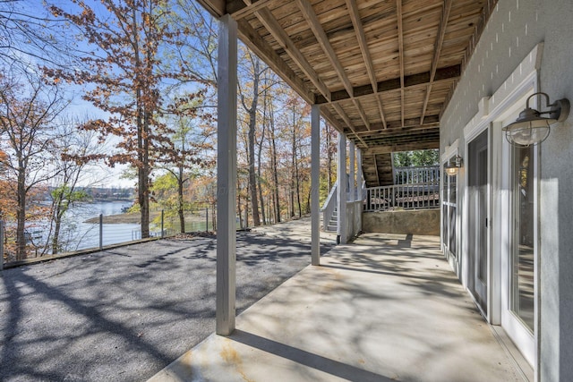 view of patio with a water view