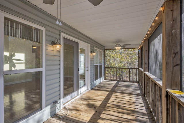 wooden deck featuring ceiling fan and a porch