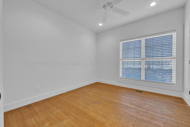 spare room featuring ceiling fan and light hardwood / wood-style flooring