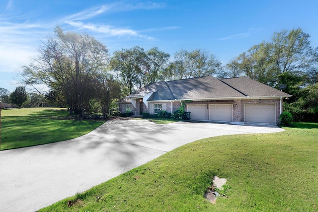 single story home featuring a garage and a front lawn