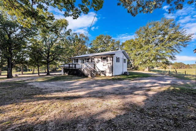 view of side of property with a deck