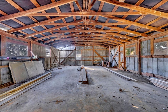 misc room featuring concrete floors and vaulted ceiling