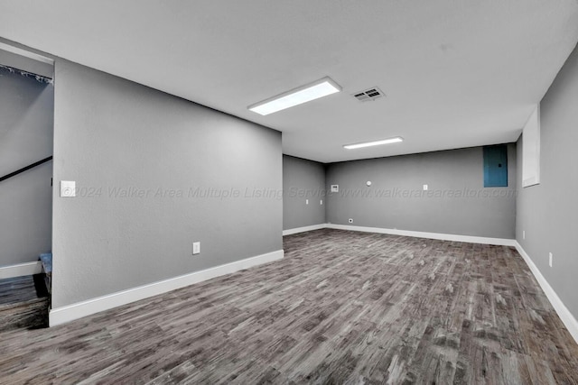 basement featuring wood-type flooring