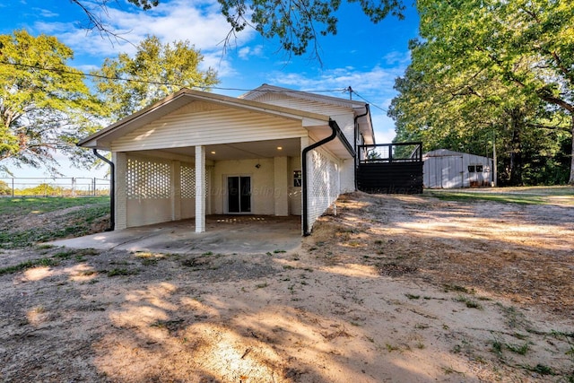 exterior space with a shed and a carport