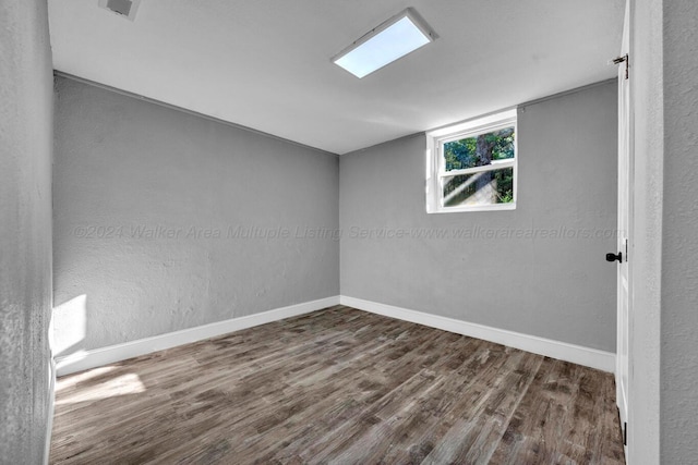 unfurnished room featuring dark hardwood / wood-style flooring