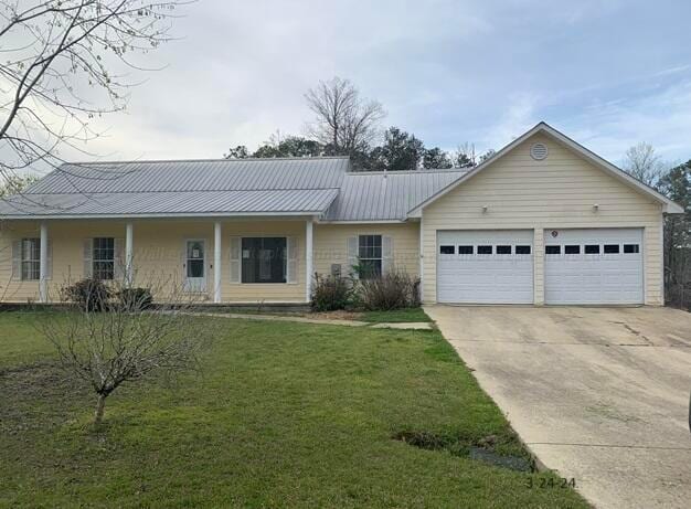 single story home with a front yard and a garage