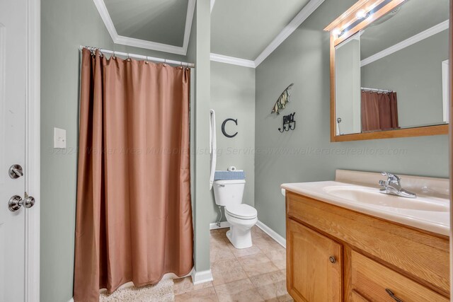 bathroom with tile patterned flooring, vanity, toilet, and crown molding