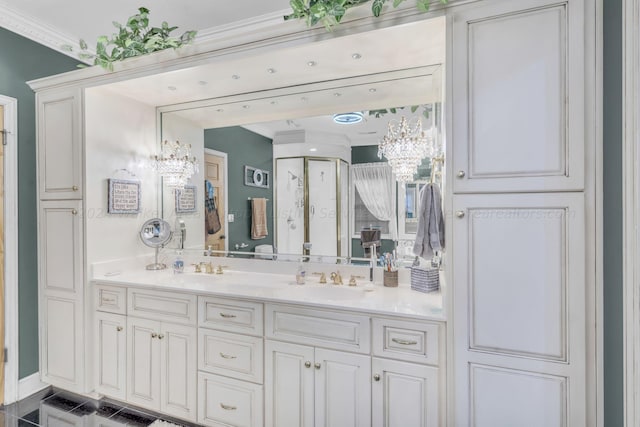 bathroom with vanity, ornamental molding, and a shower with door