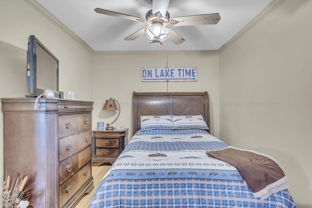 bedroom featuring ceiling fan, wood-type flooring, and ornamental molding