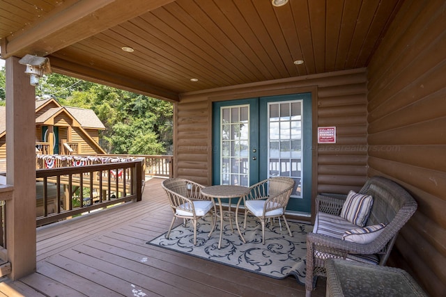 wooden deck featuring french doors