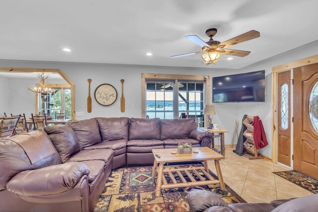 living room with light tile patterned floors and ceiling fan with notable chandelier