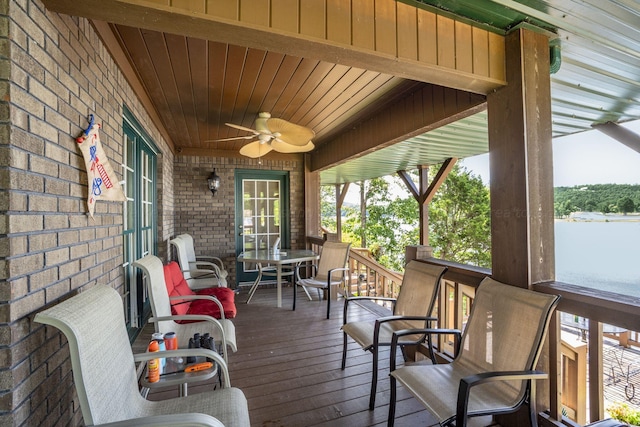 wooden deck featuring ceiling fan