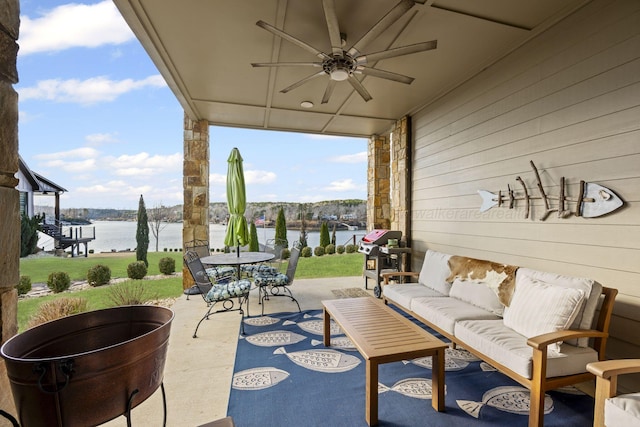 view of patio / terrace featuring ceiling fan, a grill, a water view, and an outdoor hangout area