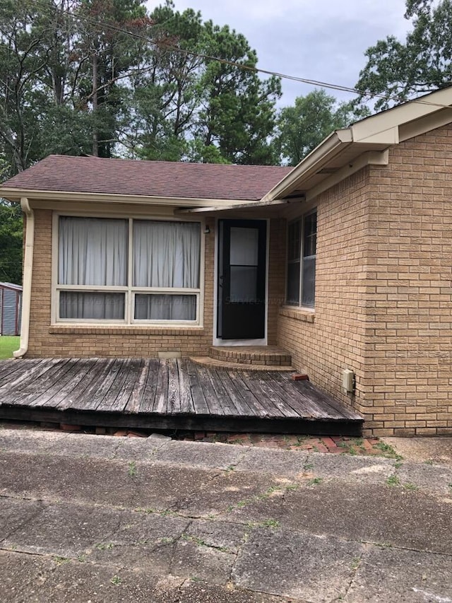 doorway to property featuring a deck