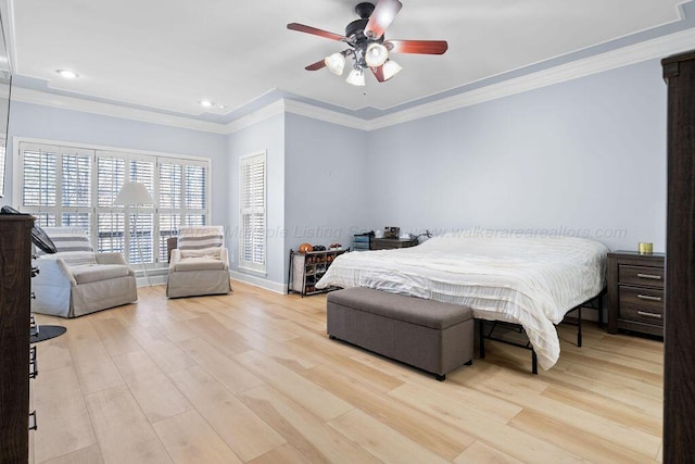 bedroom with ornamental molding, light wood-type flooring, baseboards, and a ceiling fan