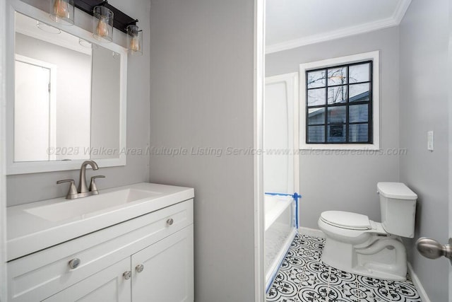 bathroom featuring tile patterned floors, toilet, vanity, and crown molding