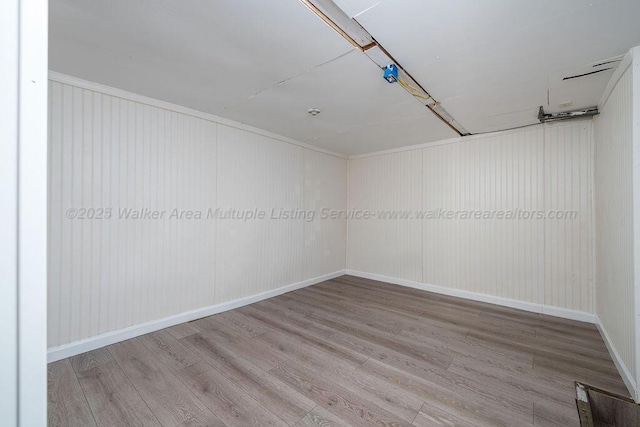 empty room with wood-type flooring