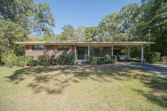 view of front of home featuring a carport, a porch, and a front lawn