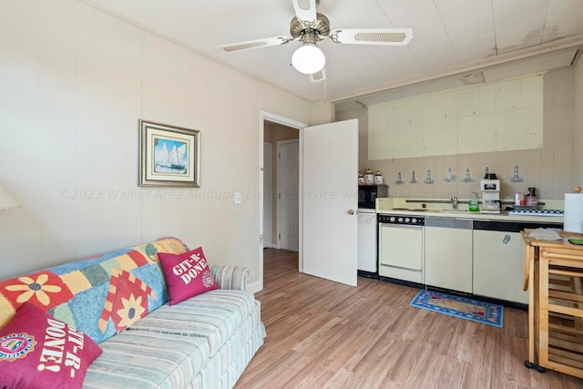 kitchen featuring dishwasher, light hardwood / wood-style floors, crown molding, and ceiling fan