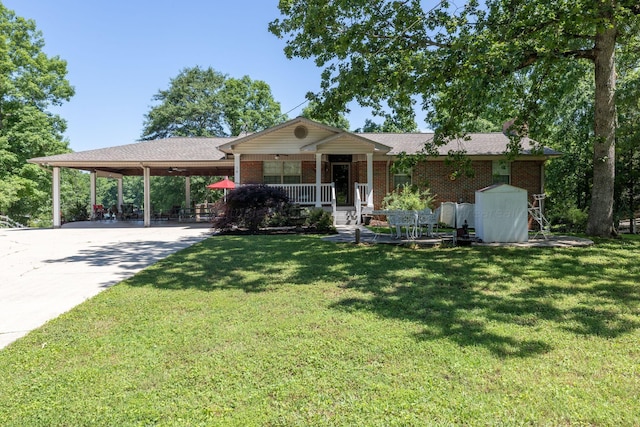 view of front of property featuring a carport, covered porch, and a front lawn