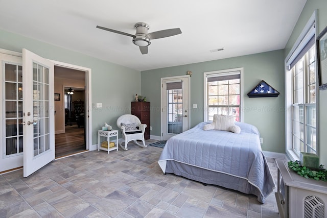 bedroom featuring french doors, access to outside, and ceiling fan