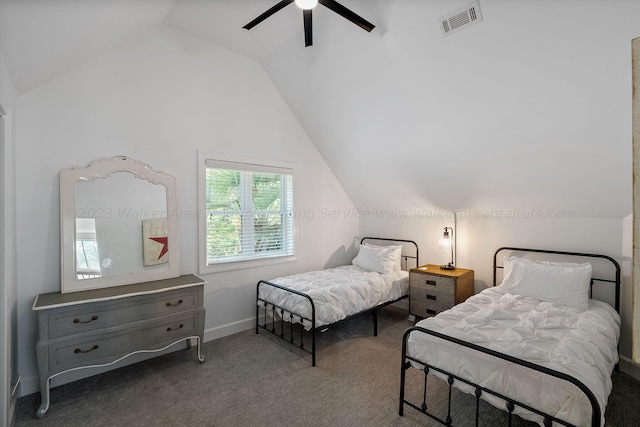 bedroom featuring vaulted ceiling, dark carpet, and ceiling fan